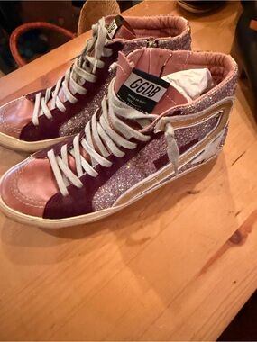 Golden Goose Pink Glitter High-Top Sneakers for Women from London fashion week.